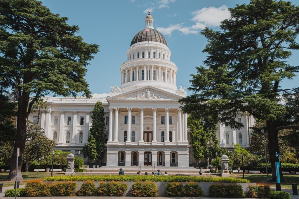 California State Capitol Building framed by trees on both sides